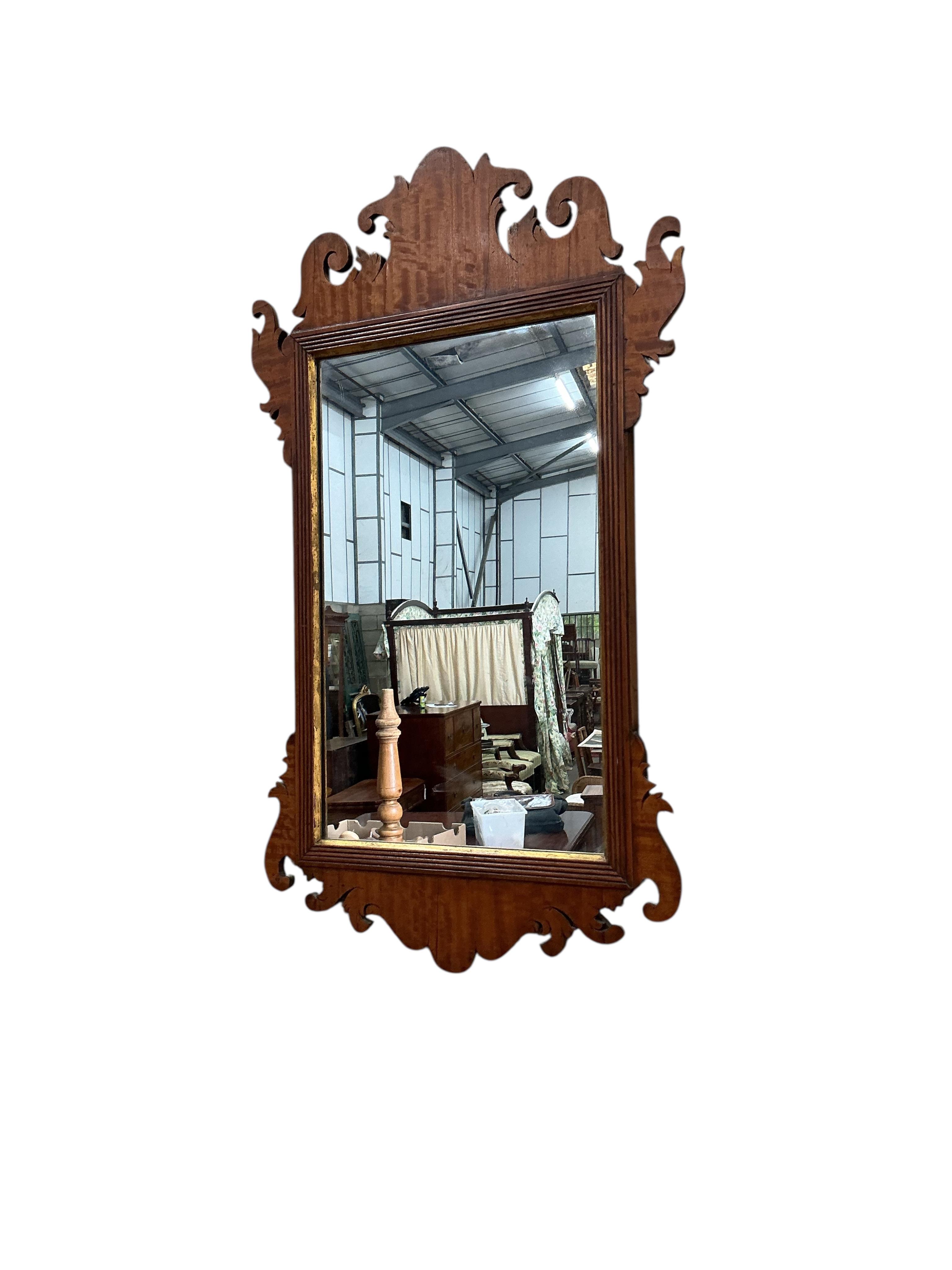 A George III style satinwood fretcut wall mirror, width 36cm, height 64cm